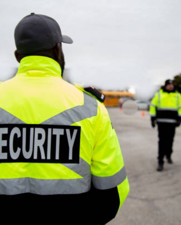 Parking security watching over the parking area. The security guard is protecting property from illegal parking and theft.